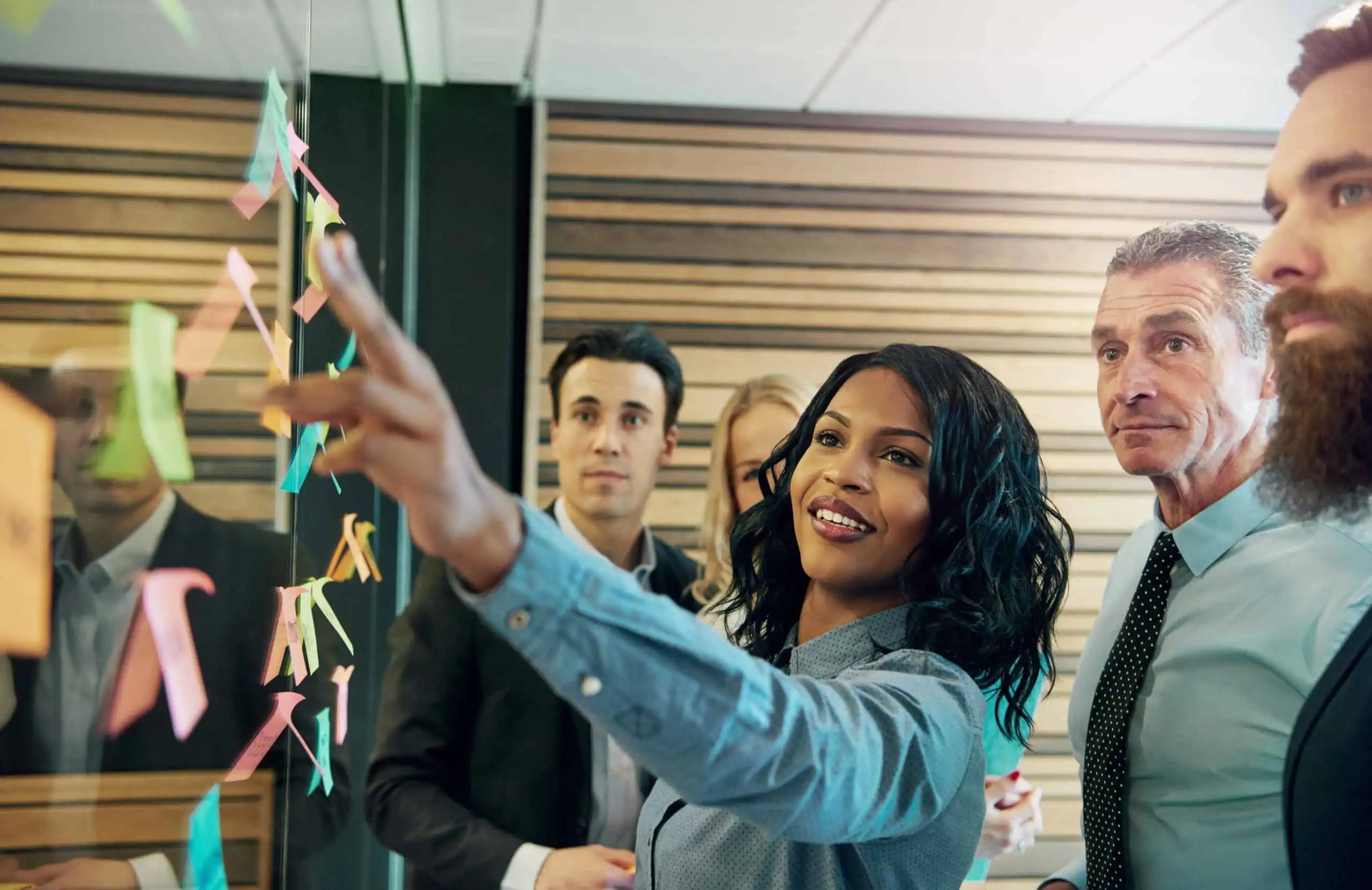 Woman explaining the plan to office team