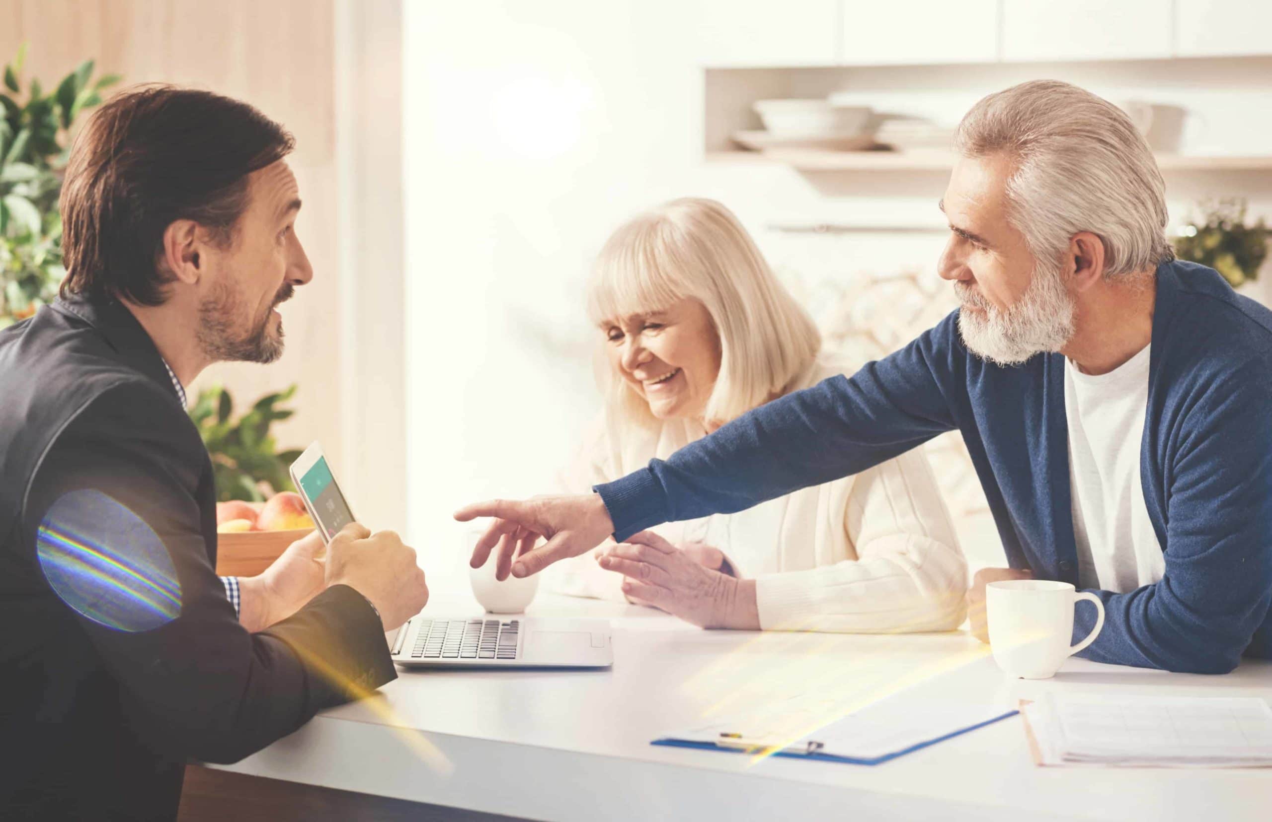 Positive old couple meeting with their insurance agent