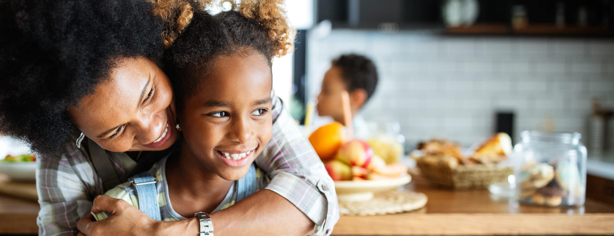 Mom Hugging Daughter